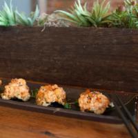 Spicy Salmon Tartare · Salmon with spicy mayo on wasabi nori chips, topped with marinated ikura, served on kaiware....