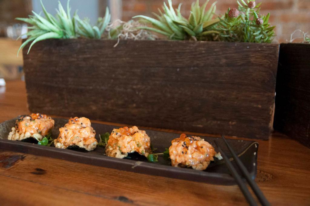 Spicy Salmon Tartare · Salmon with spicy mayo on wasabi nori chips, topped with marinated ikura, served on kaiware.  Spicy.