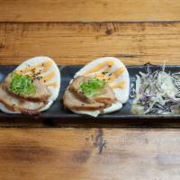 Pork Buns · Chashu pork, lettuce, and spicy mayo on steamed buns. Sprinkled with sesame seeds. Served wi...