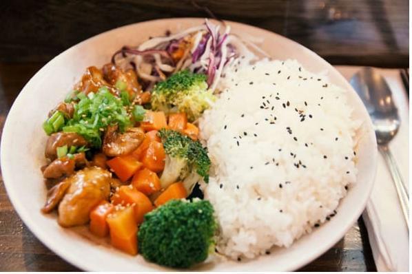 Chicken Teriyaki · Sauteed chicken thigh glazed with house teriyaki over Japanese short-grain white rice. Served with broccoli and carrots sprinkled with sesame seeds.
