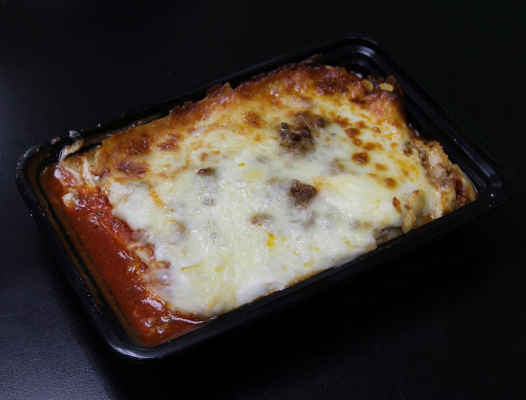 Lasagna · Served with garlic knots. Ricotta Ground Beef & Tomato Sauce, topped with Mozzarella Cheese & Sauce.