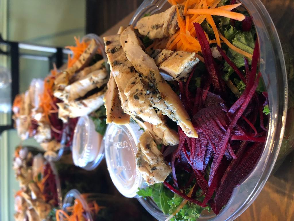 Kale Salad · Kale, carrots, beets, tomatoes, cucumbers, almonds, dried cranberries and chicken with red wine vinaigrette.