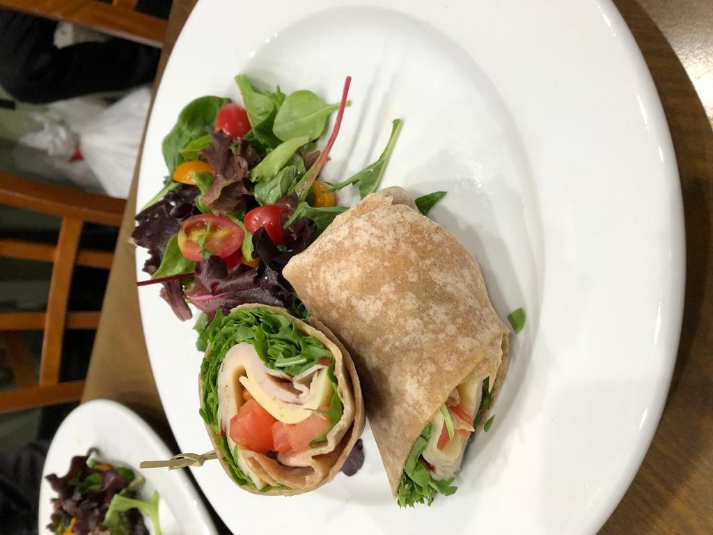 Turkey Wrap · Sun-Dried tomato spread, arugula, tomato and swiss cheese. Served with side salad.
