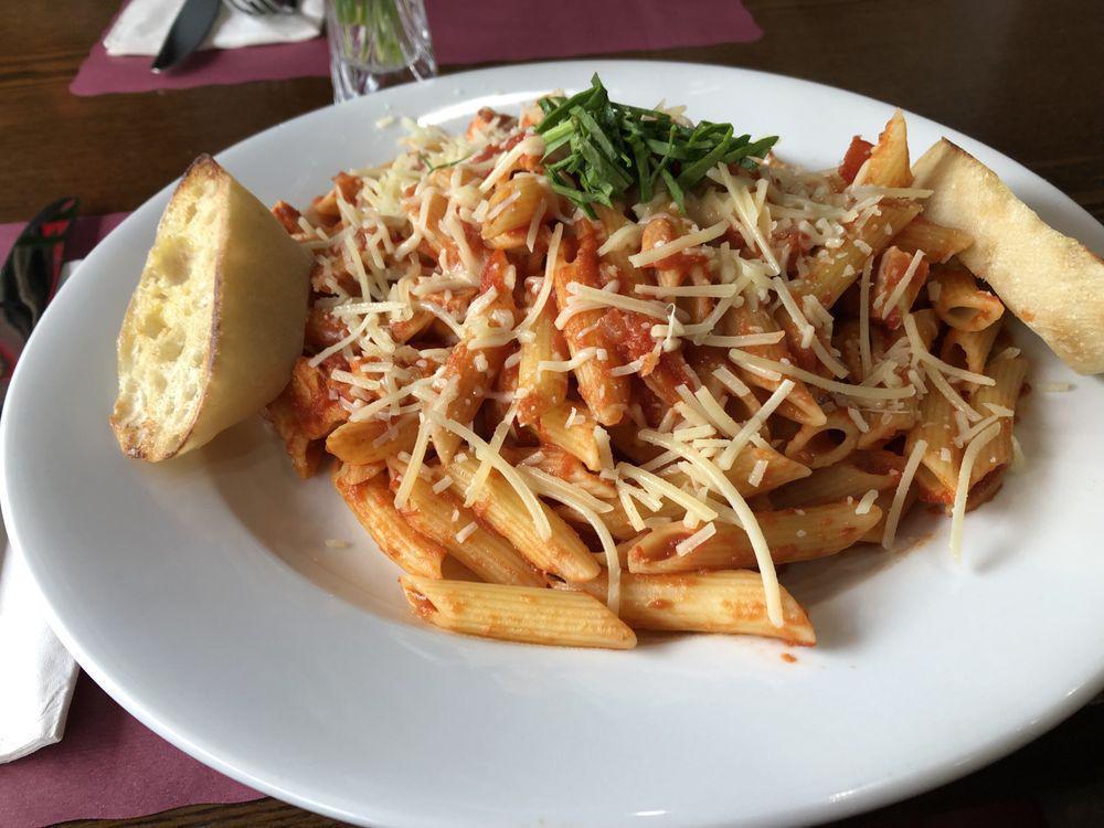 Pasta Pomodoro · Your choice of pasta in our homemade tomato sauce with fresh basil. Choose between penne pasta or spaghetti. Topped with fresh parmesan cheese.