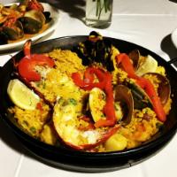 Paella Marinera Dinner · Rice with mixed seafood and lobster.
