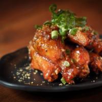 Chicken Wings · Deep fried chicken wing, sweet chili, garlic sauce and green onions.