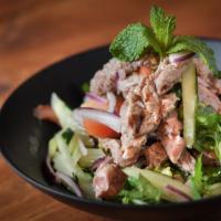 Beef Salad · Grilled slice beef, mint leaf, cilantro, onion, cucumber, tomatoes and spicy lime dressing.