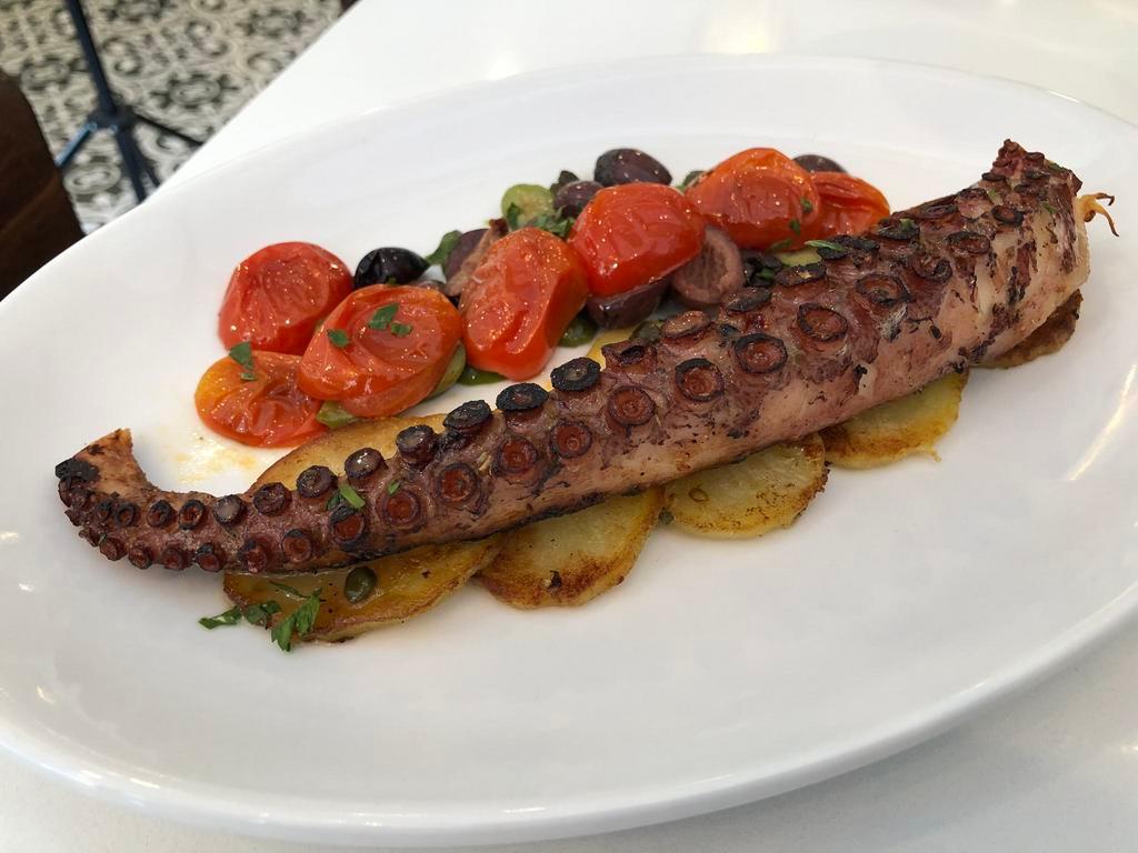 Octopus Baci · Grilled with cherry tomatoes, olives, capers, sliced potatoes, fresh herbs lemon vinaigrette