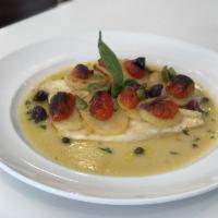 Branzino Baci · baked Mediterranean seabass, capers, olives, cherry tomatoes, sliced Yukon potatoes, lemon w...