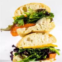Classic Chicken Sandwich · Grilled chicken, tomatoes, cheese, mixed greens with regular or chipotle mayo.