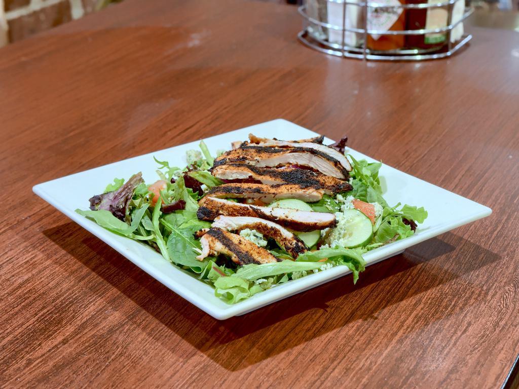 Black and Blue Salad · Mixed greens with tomatoes, cucumbers and red onions. Topped with blackened chicken and blue cheese crumbles.