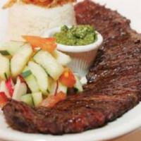 Skirt steak · Skirt  steak. Served with choice of side: rice and beans, plantain, sweet plantain, green sa...
