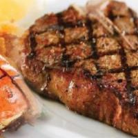 Grilled pork chops · Grill pork chop. Served with choice of side: rice and beans, plantain, sweet plantain, mini ...
