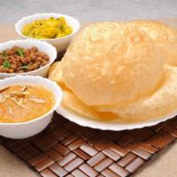 Halwa Puri Special · Serving for 1 person. Includes 2 puris, halwa, channay and achari aloo. Vegetarian.