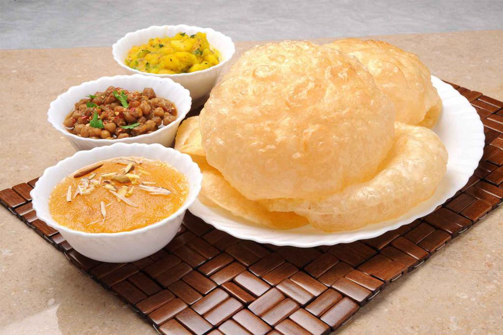 Halwa Puri Special · Serving for 1 person. Includes 2 puris, halwa, channay and achari aloo. Vegetarian.