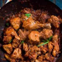 Karahi Chicken · Chicken cooked with ginger, tomatoes, spices in ghee. (Clarified butter).