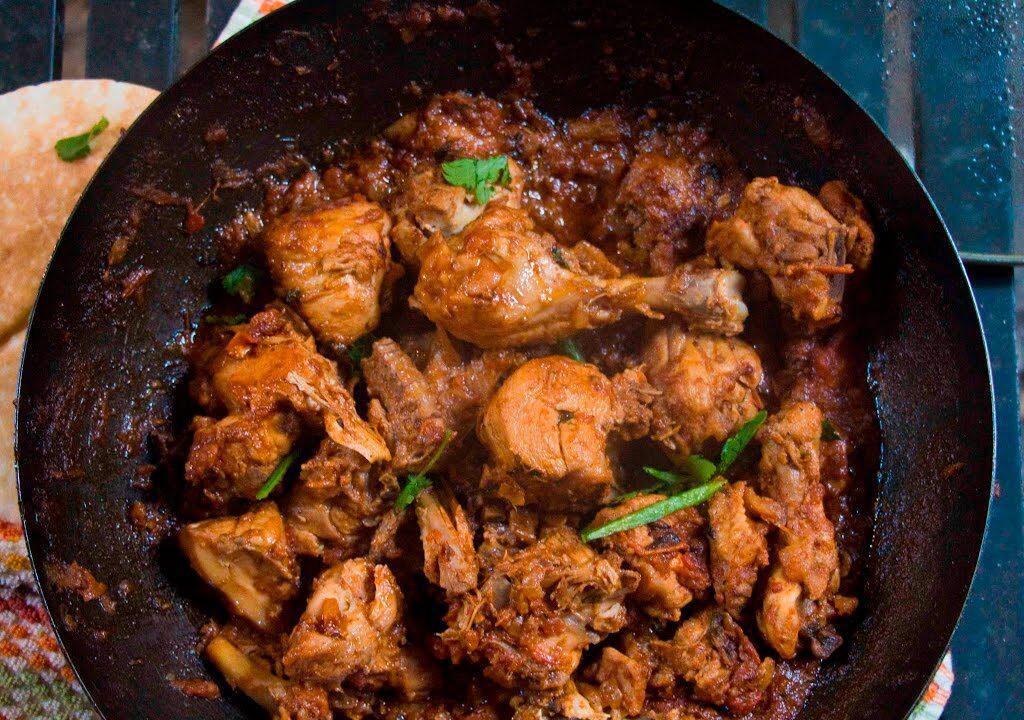 Karahi Chicken · Chicken cooked with ginger, tomatoes, spices in ghee. (Clarified butter).