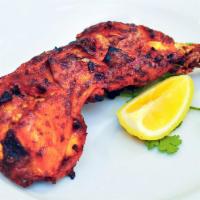 Tandoori Chicken Quarter Special · Chicken leg marinated in spices and yogurt cooked in tandoor oven.