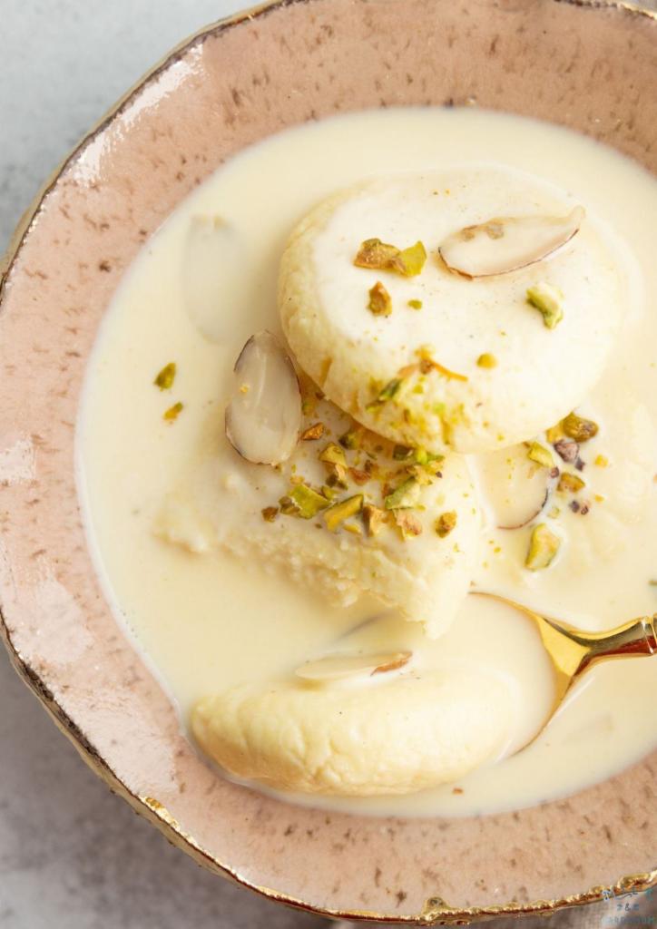 Rasmalai · 2 pieces. Clotted cream patties with cardamom served in sweet cold milk. 