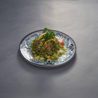 Tabouli Salad · Parsley, diced tomato, onion, cracked wheat (bulgur), olive oil and lemon juice.