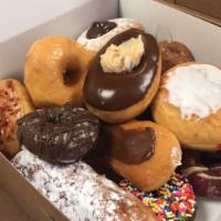 The Fancy Favs Donut Pack · A dozen of our fresh daily hand crafted donuts with a bent towards the elaborate. We feature...