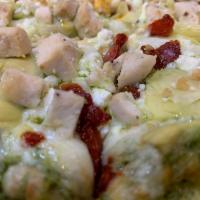 Pesto Chicken Pizza · Pesto sauce, chicken breast, artichoke hearts, roasted garlic, feta cheese and sun dried tom...