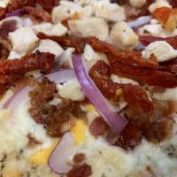 Chicken Bacon Ranch · Garlic Ranch Sauce, Chicken, Crumbled Bacon, Red Onions, Sun Dried Tomatoes