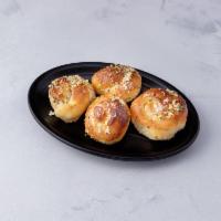 Garlic Knots - 4 pieces · Rolled baked garlic bread.
