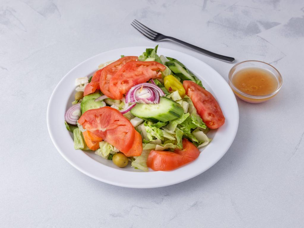 Garden Salad · Mixed lettuce, tomatoes, onions, hot pepper, celery, carrots and olives.