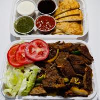 Lamb Platter · Served with lamb gyro, rice, and  fresh lettuce. Along with your choice of toppings and sauce.