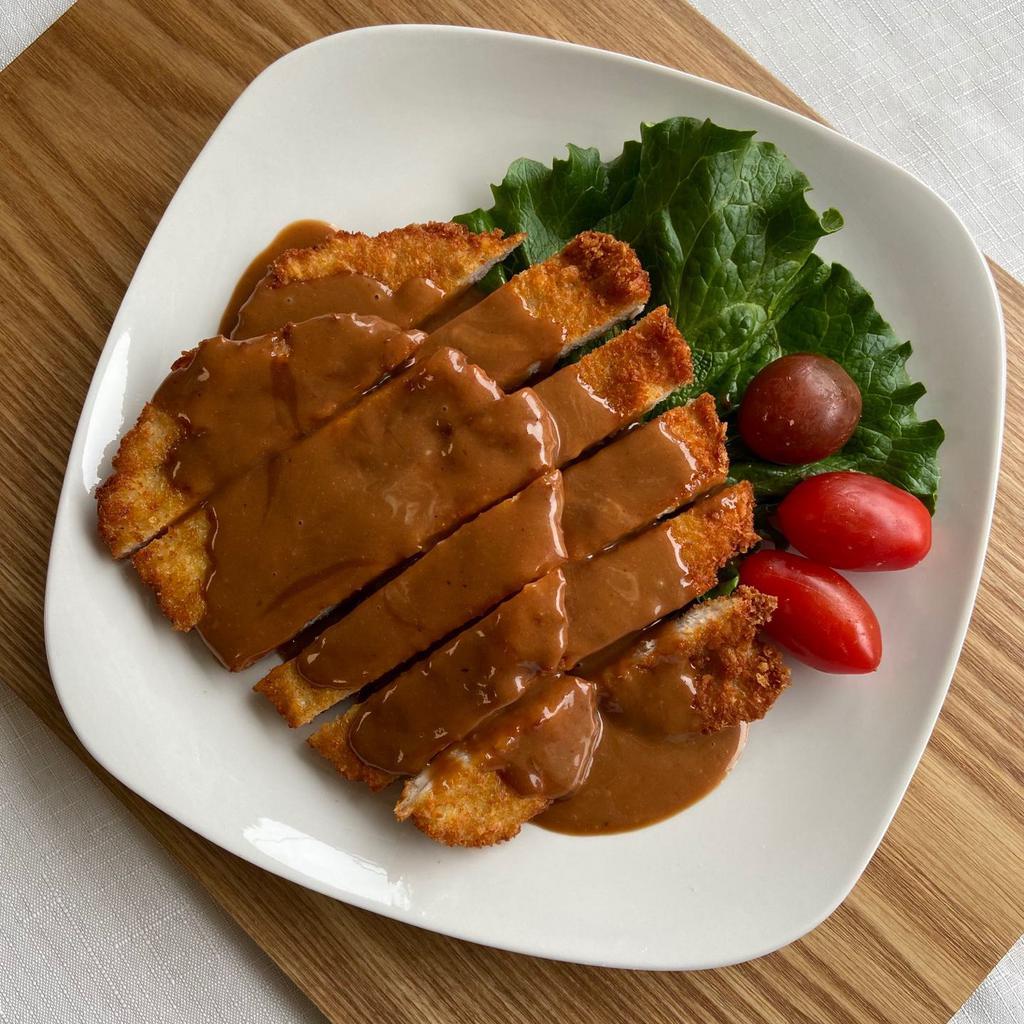 Pork Cutlet · 28 oz. Covered pork with flour, eggs and panko and fried it and demi glace sauce & rice.