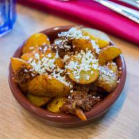 Papas and Chorizo · Roasted potatoes tossed with 100 chile chorizo.