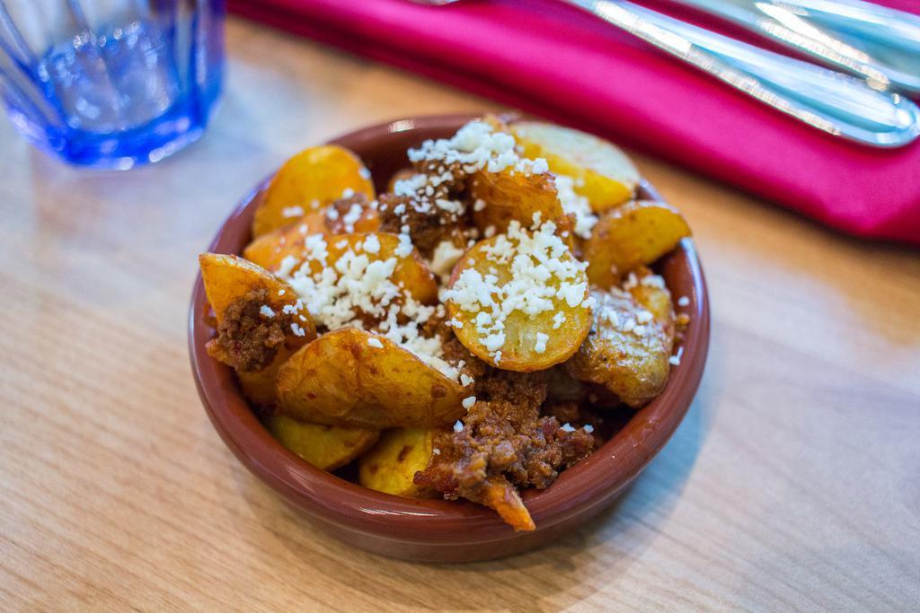 Papas and Chorizo · Roasted potatoes tossed with 100 chile chorizo.