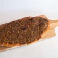 Zatar Manaqeesh · A homemade flatbread topped with za'atar.