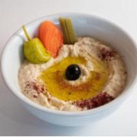Babaganoush · A homemade dip made from cooked eggplant mixed in with tomatoes, olive oil, tahini and vario...