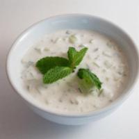 Cucumber Yogurt · A delicious mix of cucumber pieces, mint, garlic and yogurt.