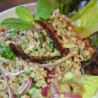 Laab E-sarn  · Lettuce wrapped salad. Choice of ground pork or chicken tossed with chili powder, red onion,...