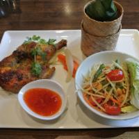 BBQ Chicken · Grilled half chicken with your choice of papaya salad or steamed mixed vegetables served wit...