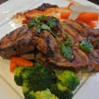 Lemongrass Pork Chop · Grilled marinated pork chop with lemongrass and Thai herb of steamed mixed vegetables.