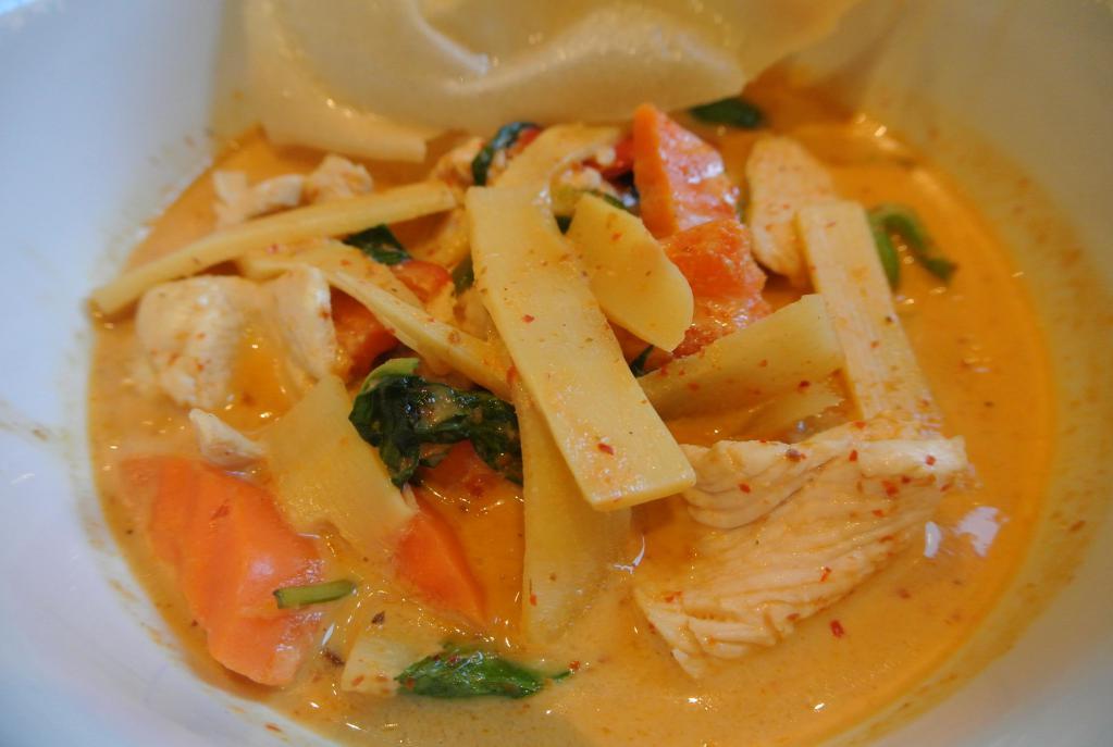 Red Curry · Red curry paste with bamboo shoot, eggplant, carrot, bell pepper, basil in coconut milk. Medium Spicy.