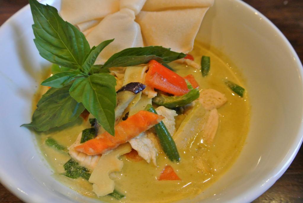 Green Curry · Green curry paste with bamboo shoot, zucchini, carrot, bell pepper string beans, eggplant and basil in coconut milk. Medium Spicy.