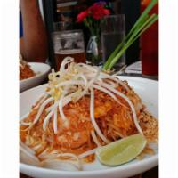 Pad Thai · Stir fried thin rice noodles with peanut, bean sprouts, chives, egg, sweet radish and bean c...