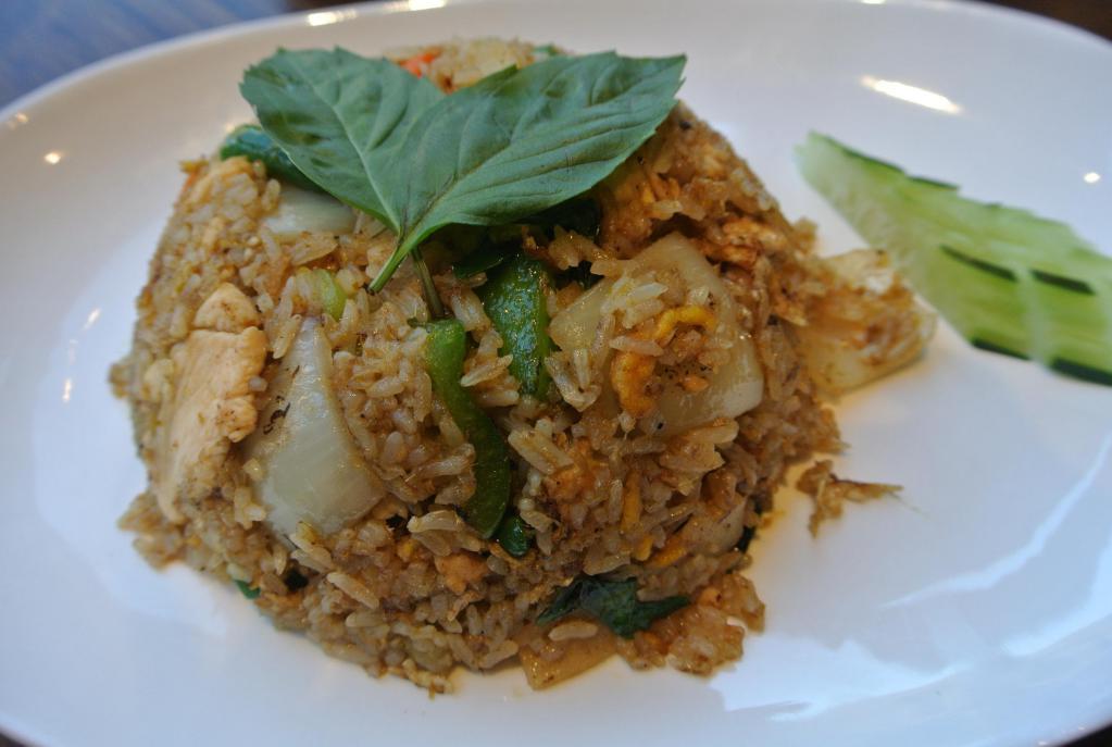 Spicy Basil Fried Rice · With basil, bell pepper, onion, bamboo shoot, string beans, Thai chili, carrot and egg. Spicy.