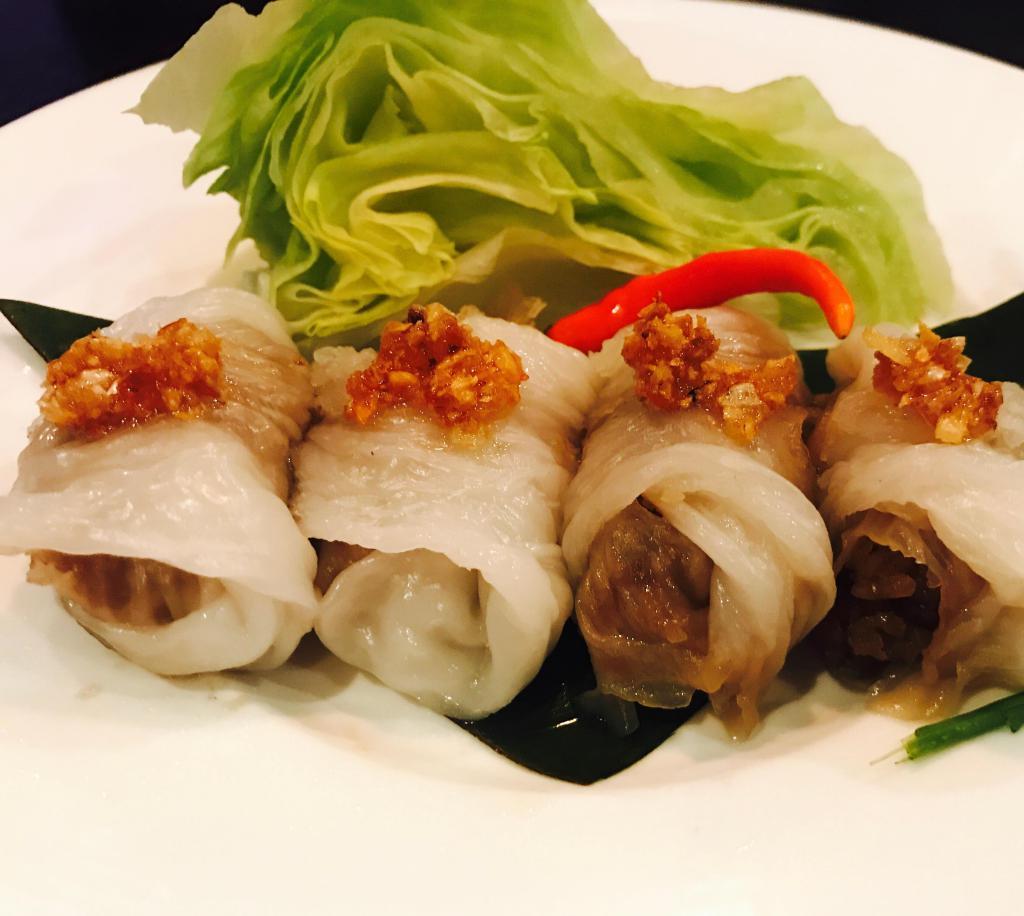 4 Khao Griep Pak Mor · Sauteed ground peanut, sweet radish, red onion, chili, romaine and cilantro wrapped with homemade steamed rice skin dumpling. Gluten free.