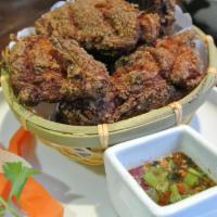 6 Chicken Wings · Marinated Thai style chicken wings with chef's special sauce.