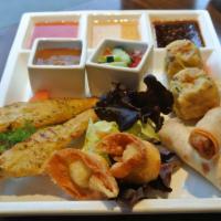 Combo Appetizer for 2 · Chicken and shrimp dumpling, chicken, satay, crab Rangoon and spring rolls.