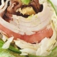 Turkey Avocado Wrap · Roasted turkey, avocado, bacon, Romaine lettuce, tomato slices, red onions, and spicy sauce ...
