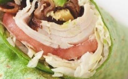 Turkey Avocado Wrap · Roasted turkey, avocado, bacon, Romaine lettuce, tomato slices, red onions, and spicy sauce in your choice of wrap or bread.