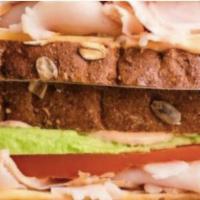 Turkey Avocado BLT Sandwich · Roasted turkey, avocado, bacon, Romaine lettuce, tomato slices, red onions, and house spicy ...