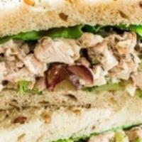 Chicken Salad Sandwich · Chicken salad (made with red onion, celery, pickles, mayo and spices) paired with mixed gree...